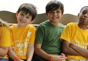 Summer camp kids on swing