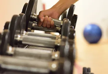 Women Grabbing Weights