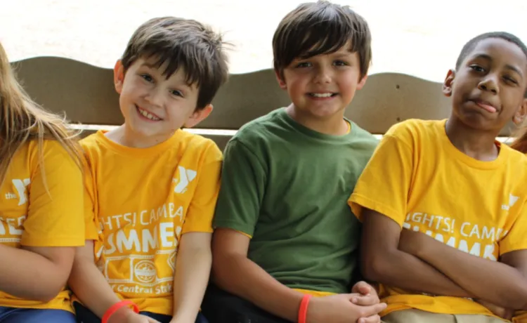 Summer camp kids on swing