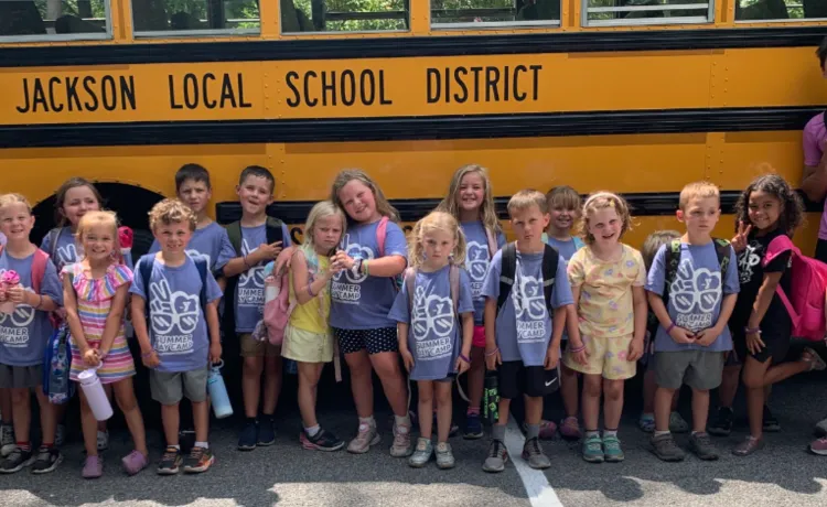 Kids in front of bus