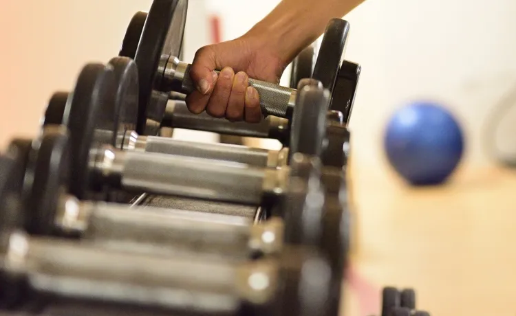 Women Grabbing Weights