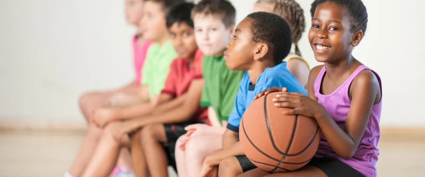 kids holding basketball