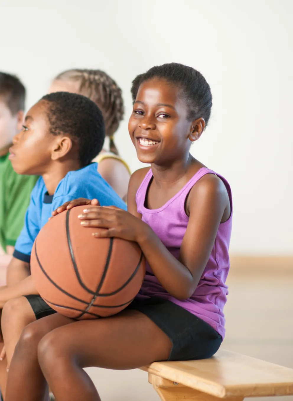 kids holding basketball