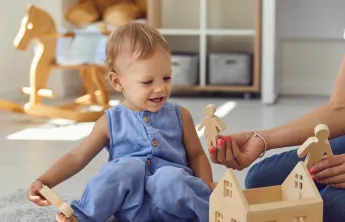 Young Child Playing with Toys